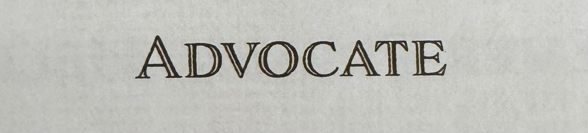 Advocate in serif type on textured paper