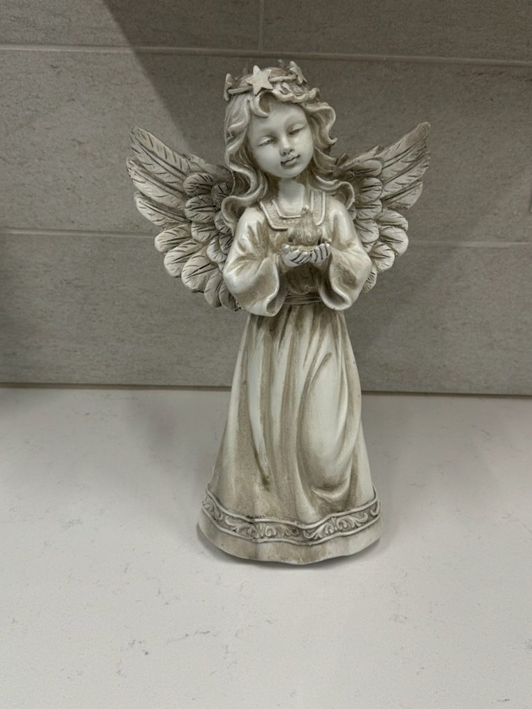 Praying angel figurine with detailed feathered wings