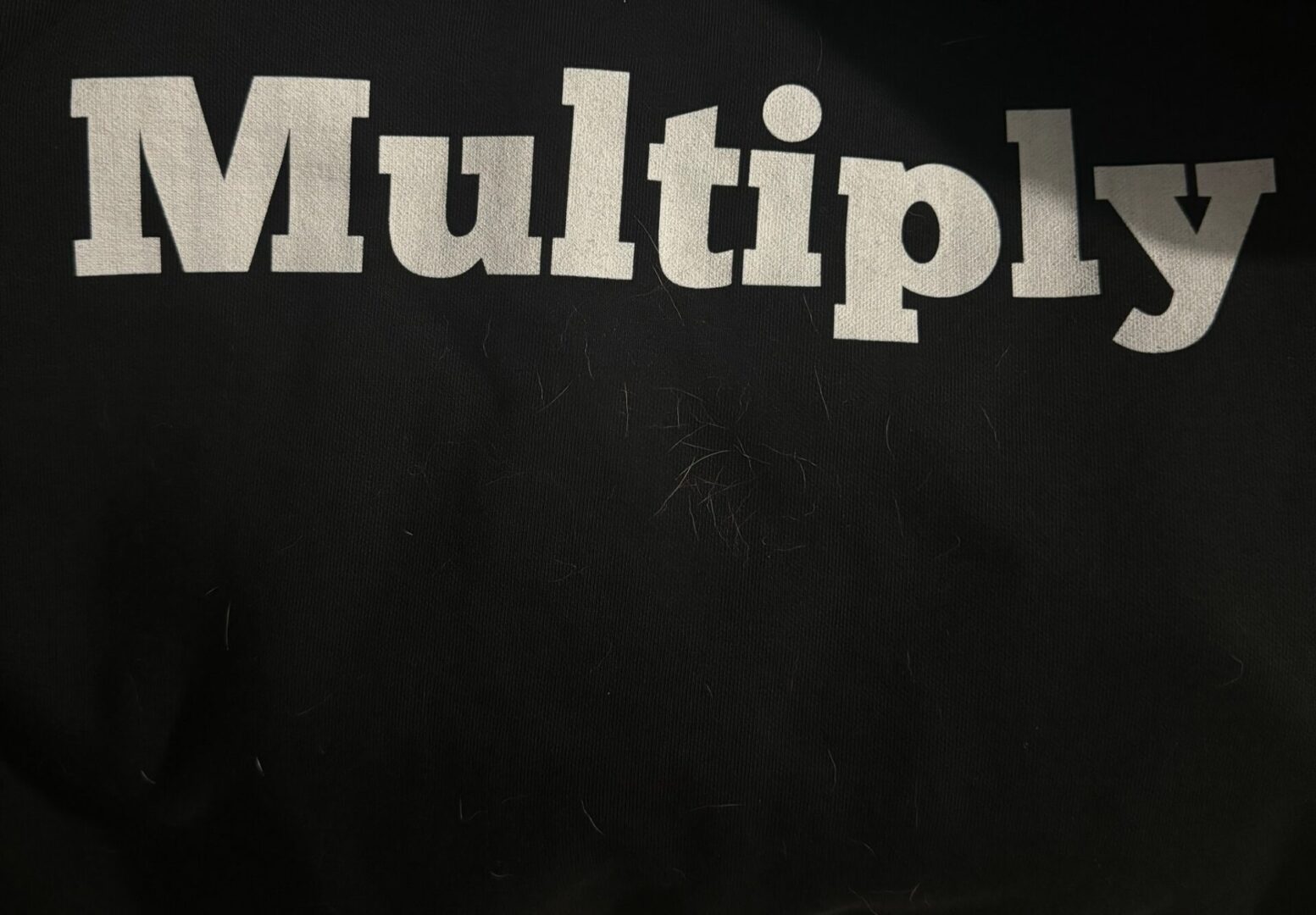 Large white "Multiply" text on black background