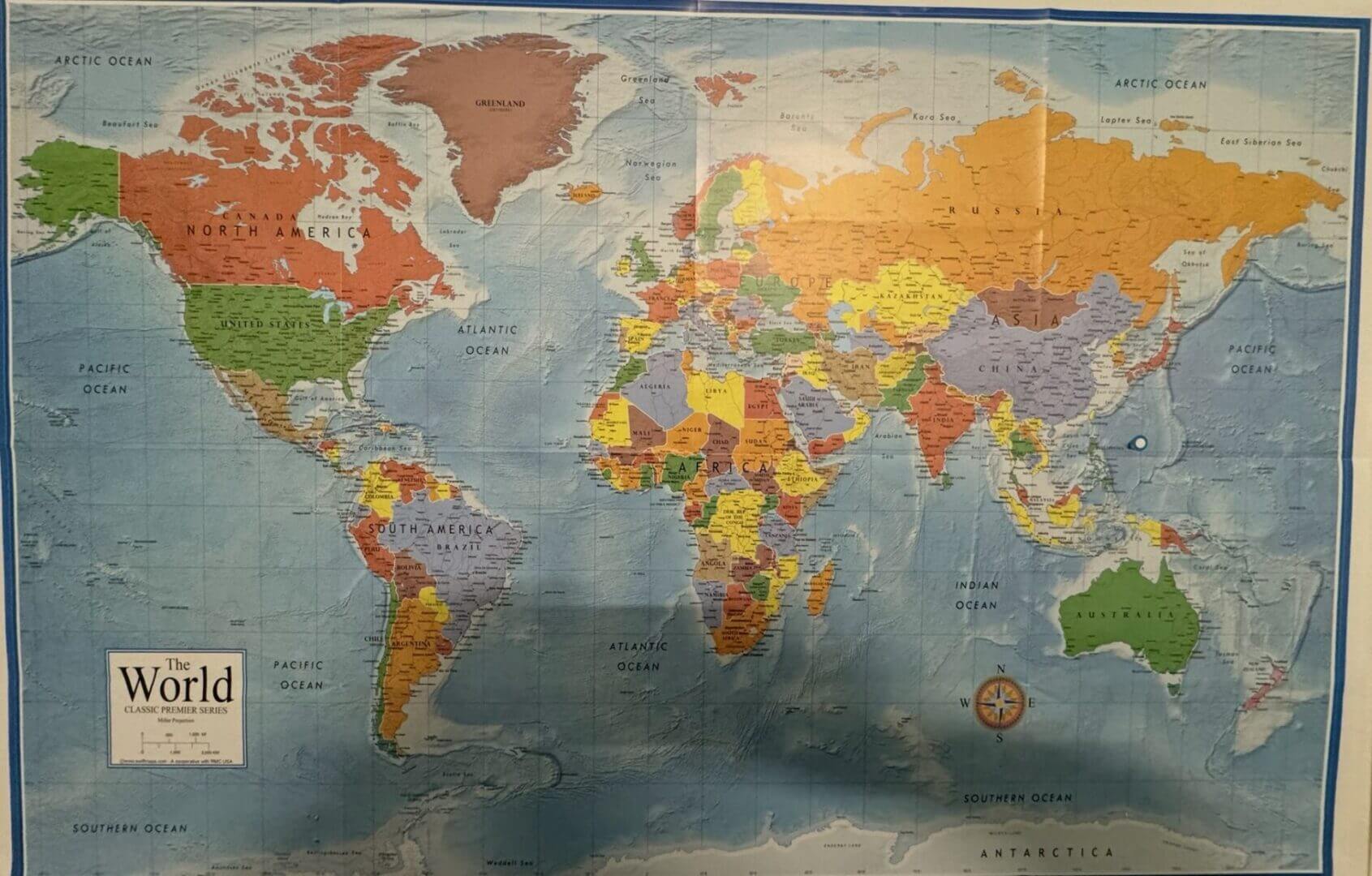 Colorful political world map poster on wall